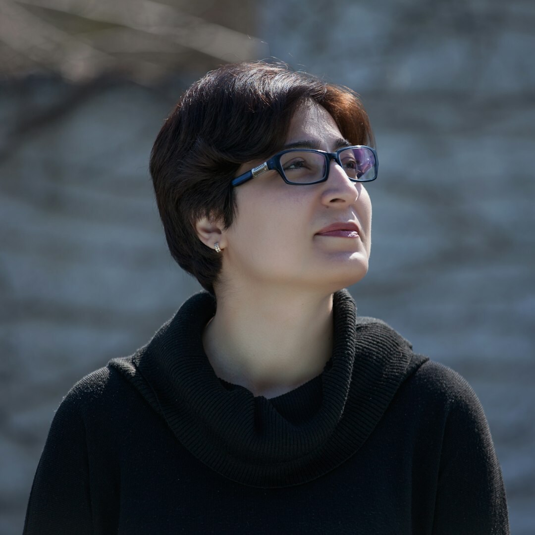 Professional portrait of a woman in her 40s with short hair and blazer